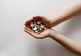 Close-Up View of Hands Holding Pills