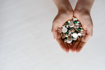 Close-Up View of Hands Holding Pills