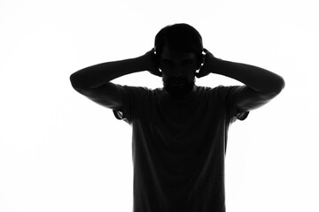 silhouette of a man gestures with his hands black and white photo