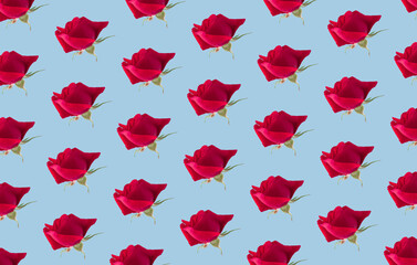 Flower pattern made of red roses on pastel background. Creative romantic concept.