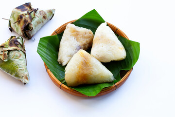 Grilled sticky rice in banana leave with mung beans filling