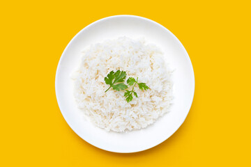 Dish of rice on yellow background.
