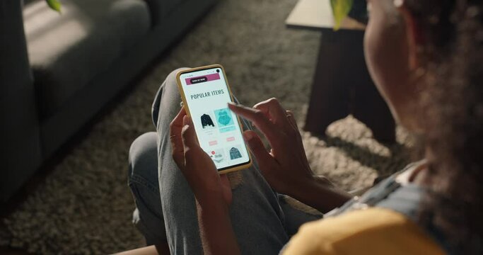 woman using smartphone shopping online buying clothes browsing online store e commerce on mobile technology