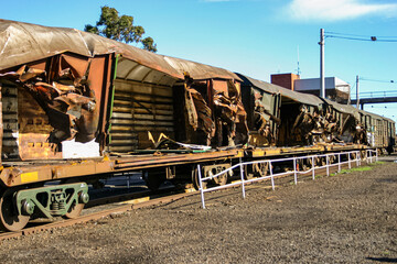 Rusty train carriage wreckage after a train crash