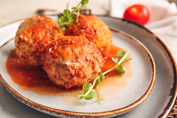 Plate with delicious meatballs on table, closeup