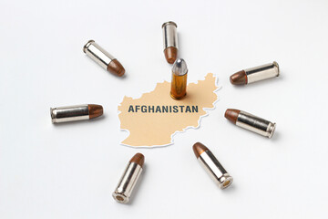 Afghanistan map logo icon with real gun bullet ammo around country on white background in concept of middle east war and conflict