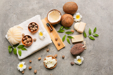 Composition with shea butter, nuts and bath supplies on grunge background