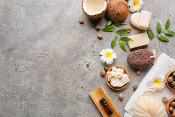 Composition with shea butter, nuts and bath supplies on grunge background
