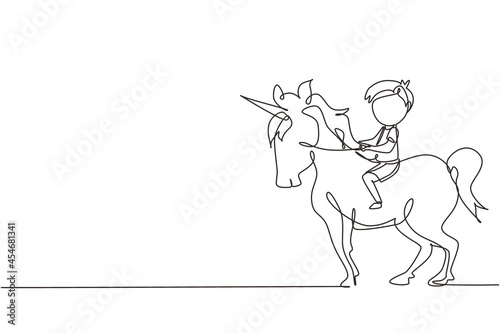 Wall mural Continuous one line drawing happy cute boy riding cute unicorn. Child sitting on back unicorn in fairy tale dream. Kids learning to ride unicorn. Single line draw design vector graphic illustration