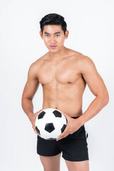 Fitness man holding a soccer ball isolated on white background