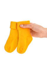 Woman holding baby socks on white background