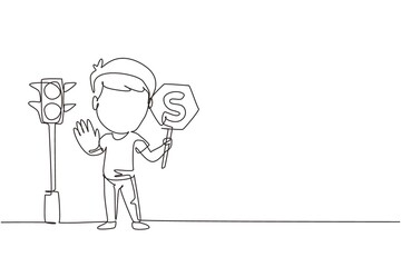 Single continuous line drawing little boy holding stop sign in arm standing near road, pedestrian rules for kids, traffic light in vector style. Child holding stop sign. Dynamic one line draw graphic
