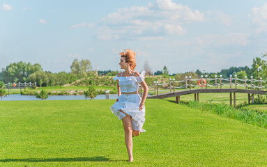 Lady in white cotton suit, crop top and skirt at nature, vacation scene