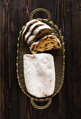 Christmas stollen top view, on wooden background