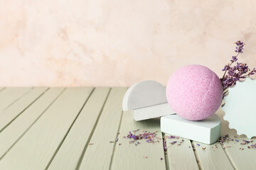 Composition with lavender bath bomb on wooden table