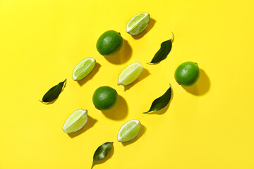 Tasty limes on color background