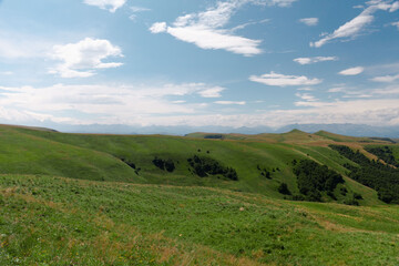 Panoramic view of green hills and mountains