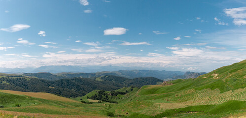 Panoramic view of green hills and mountains