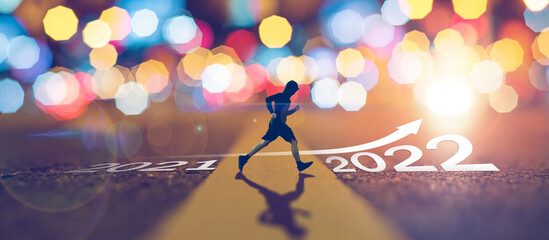 man running on street 2021 moving to new year 2022,leadership vision and new ideas,concept of happy...