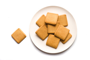 top view, plate with dry biscuits. isolated white background