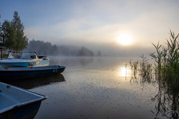 Naklejka premium Early morning. Fog on the river. Beautiful sunrise in the summer by the river.River on an early summer morning at dawn.