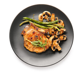 Plate with tasty pork steak and grilled vegetables on white background