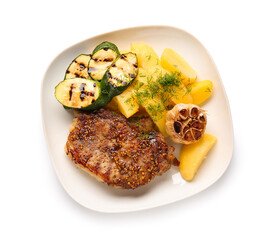 Plate with tasty pork steak and grilled vegetables on white background