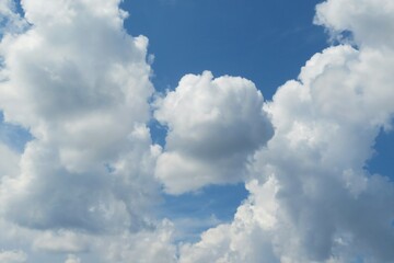 Naklejka na ściany i meble Beautiful shaped clouds in blue sky, natural background