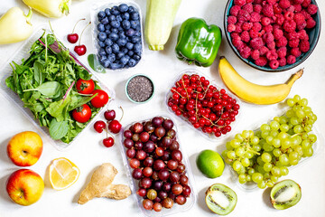 top view of vegetables, fruits, berries on a white background close up