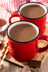 Traditional Mexican chocolate atole drink on rustic wooden table