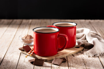 Traditional Mexican chocolate atole drink on rustic wooden table