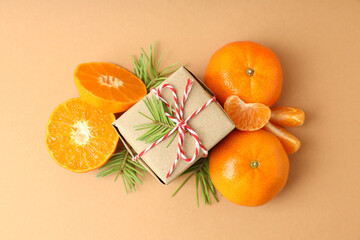 Christmas concept with mandarins on beige background