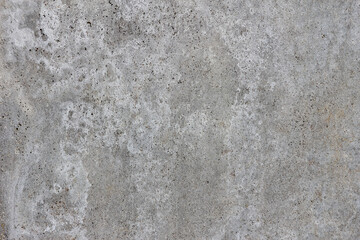 A concrete wall. The surface of an old weathered concrete wall with streaks. Texture background