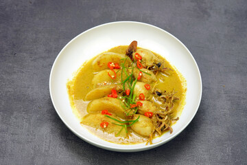 Indonesian food, squid curry with potato and coconut milk