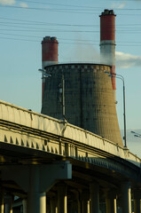 Thermal power plant (TPP) and overhead road in Moscow during sunset