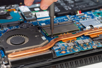 Disassemble the laptop for repair, chips, processor and boards inside the computer