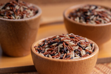Jasmine Brown Rice in wooden bowl with copy space, Thai rice varieties Top view
