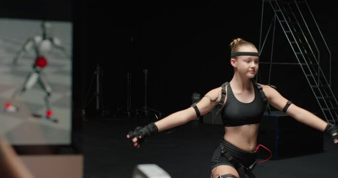 dancing woman wearing motion capture suit in studio ballet dancer girl wearing mo-cap suit for 3d character animation for virtual reality technology