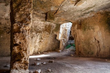 Fototapeta na wymiar Christian Catacombs at Fabrica Hill, Paphos Cyprus, which were used as a refuge from Roman persecution which are a popular tourist holiday travel destination and attraction landmark, stock photo image