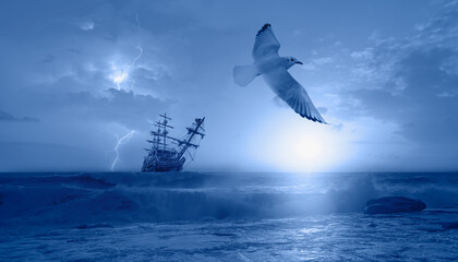 Sailing old ship in a storm sea with seagull flying, stormy clouds in the background 