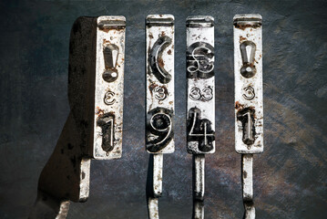 vintage old typewriter hammers with the date 1941  isolated