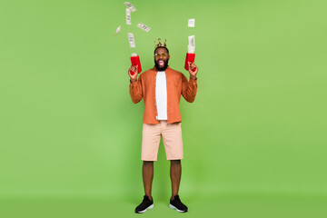 Full size photo of hooray young brunet guy with money gun wear eyewear shirt shorts sneakers...