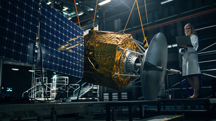 Industrial Engineer Working on Artificial Satellite Construction. Aerospace Agency: Female...