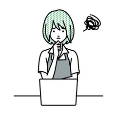 デスクで座ってPCを開いて困っているカフェ店員の女性
