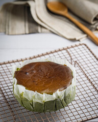 Basque Matcha burnt cheesecake freshly bake on white table