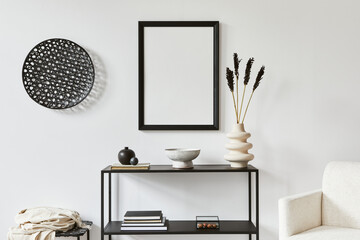 Minimalistic stylish composition of creative room interior design with mock up poster frame, metal shelf, armchair and personal accesories. Black and white concept. Template.