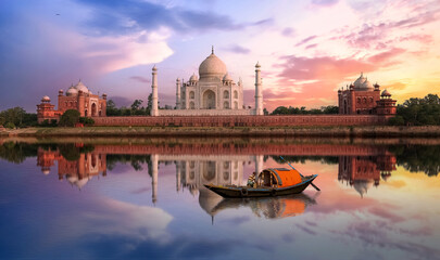 Taj Mahal at sunset with water reflection and fishing boat on river Yamuna at Agra, India © Roop Dey