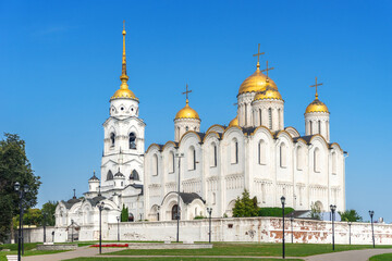 Fototapeta na wymiar Holy Assumption Cathedral Orthodox church in Vladimir - An outstanding monument of white stone architecture of pre-Mongol Russia. Scenic view in sunny summer day with clear blue sky