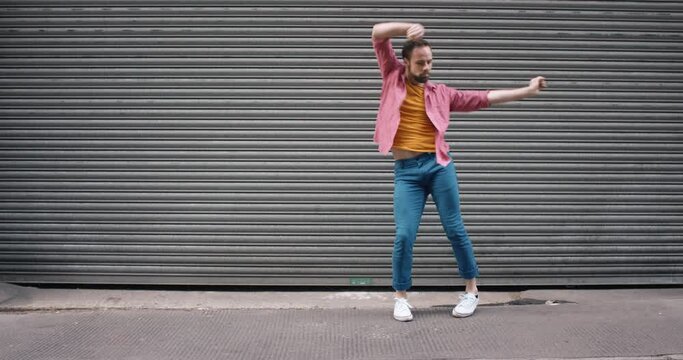 dance loop funny man dancing in street having fun celebrating with funky looping dance 4k