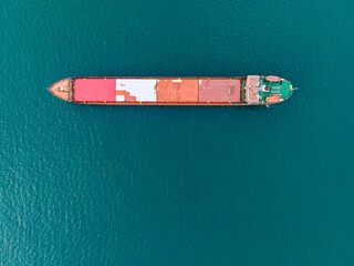 Top down aerial view of dry bulk carriers cargo ship in the sea
